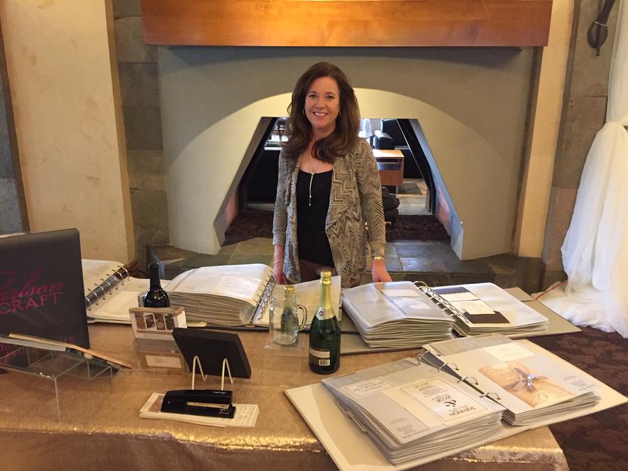 Diane Maeder from Promises West showing wedding invitations in Los Angeles.